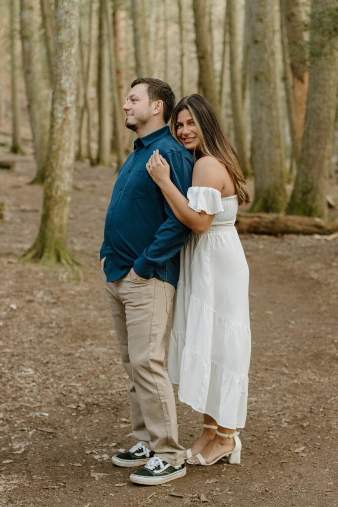 Engaged couple hugging at Devil's Hopyard State Park in East Haddam, Connecticut