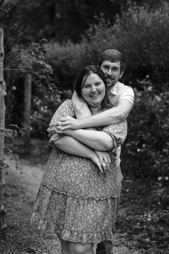 Couple embracing in the gardens at Wickham Park