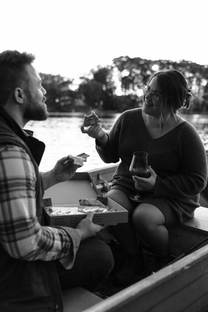 couple enjoying pizza out on the water during a couples session