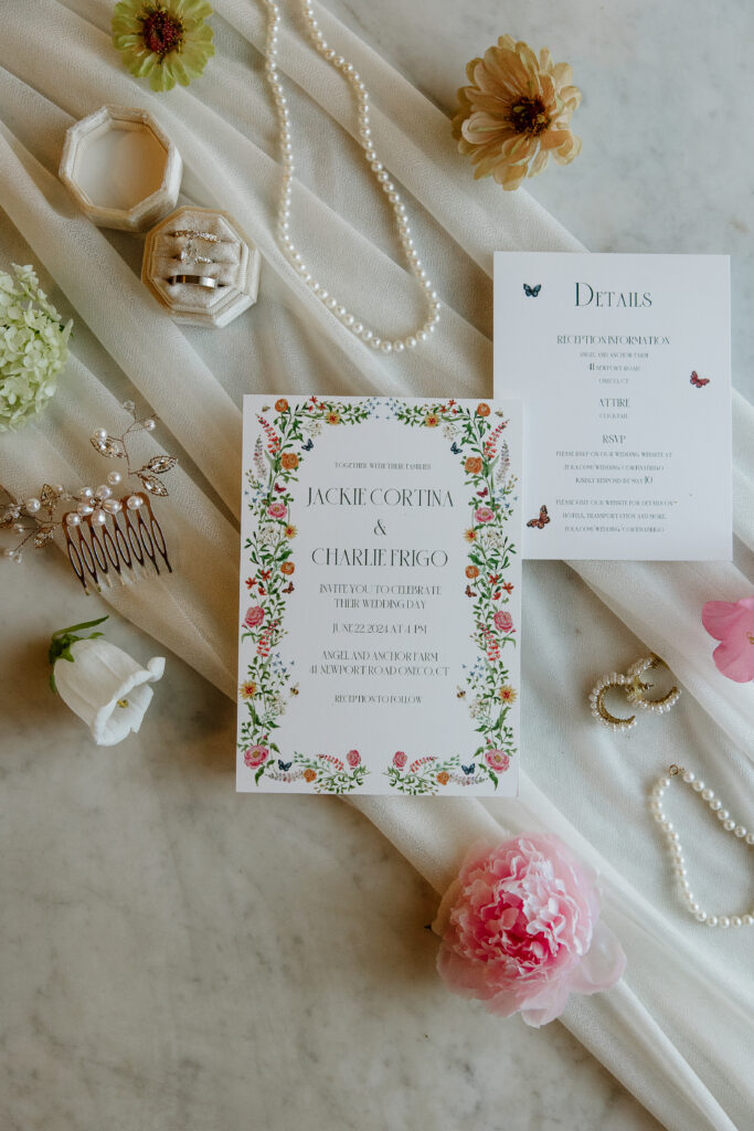 Invitation suite wedding day details flatlay