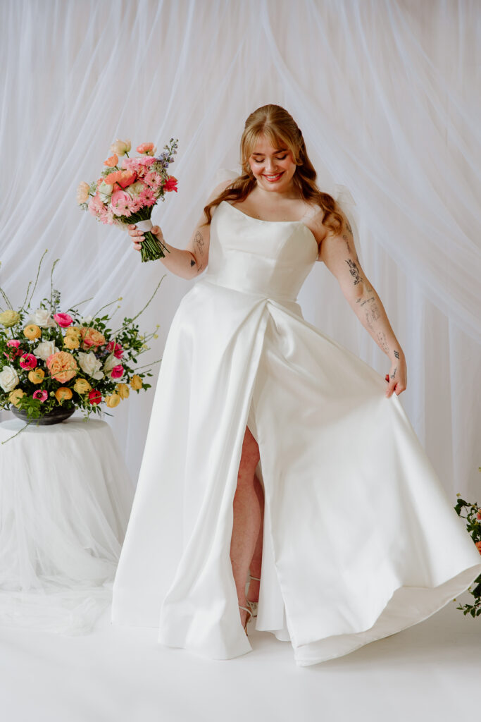 bride playing with her dress
