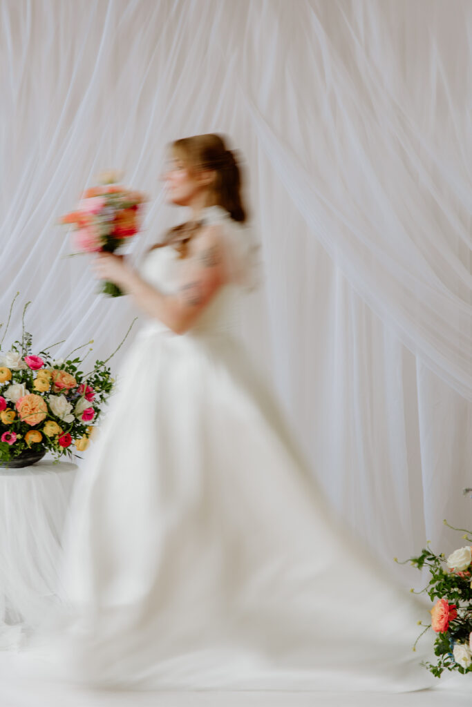 motion blur of moving bride with colorful florals